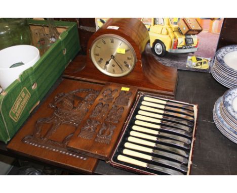 Two biscuit moulds, set of butter knives and mantle clock