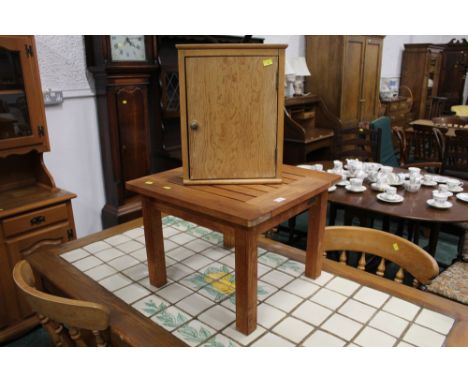 Small light wood corner cupboard and teak slatted garden table