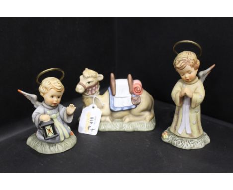 Three Hummel Nativity figures, angel standing, angel kneeling and camel 