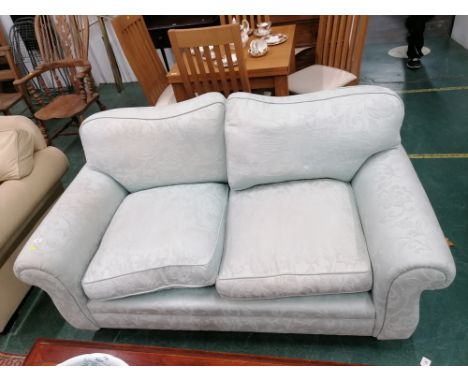 Light blue floral patterned two seater settee 