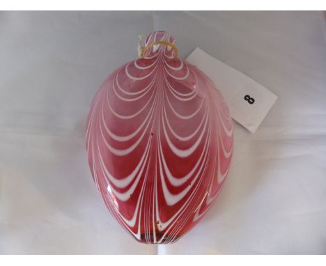 A Nailsea glass flask, 19th century, of flattened ovoid form with in graduated cranberry red glass with combed white swirls, 