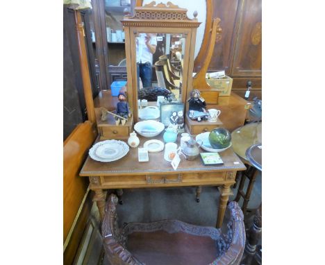 A late 19th century French walnut dressing table, the bevelled adjustable mirror with blind fret surmount and fluted uprights