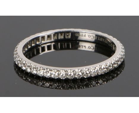 Tiffany &amp; Co, platinum and diamond eternity ring, set with diamonds surrounding the band, ring size O