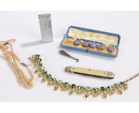 Jewellery, to include an enamel cased part button set, a necklace, knife, button hook, lighter and another necklace 