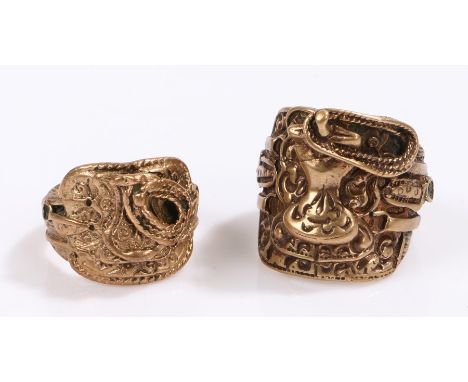Two yellow metal rings, both as Cowboy saddles, ring size T and U