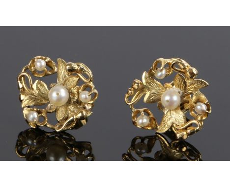 Pair of 18 carat gold pearl set ear studs, in the form of flower heads, 16mm diameter 