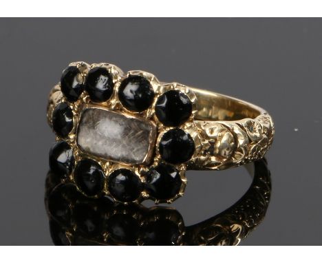 George III Mourning ring, the central glass head with a fabric panel and black bead surround, the reverse the text James Forr