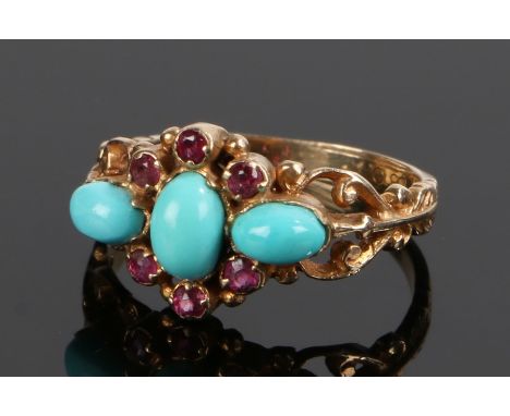 9 carat gold turquoise and ruby set ring, with scroll and swag shoulders, ring size M