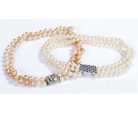 Synthetic pearl three strand necklace with clear and blue paste set clasp, similar two strand necklace (2)No visible conditio