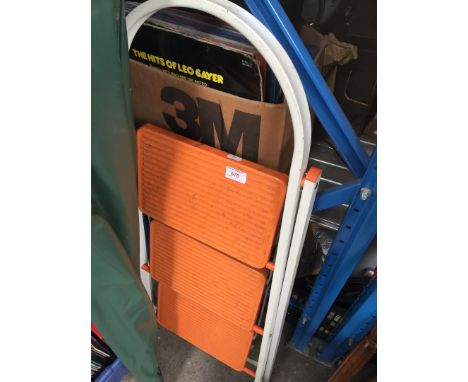 A metal folding step ladder 