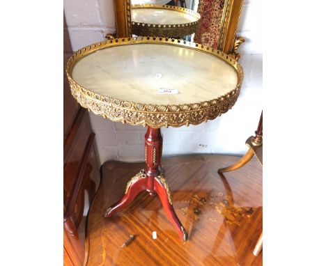 A reproduction continental style tripod occasional table with round marble top and applied gilt metal decoration by H&L Epste