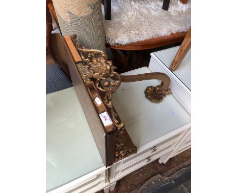 A reproduction gilt wood and amber glass wall shelf 