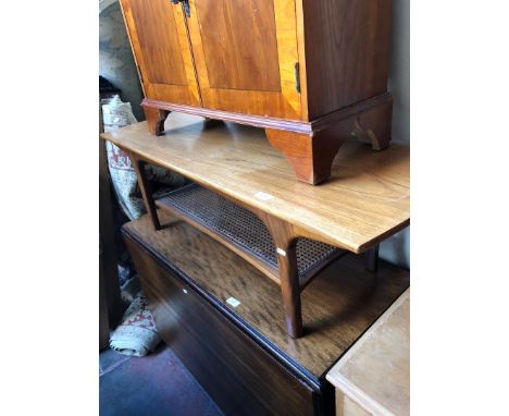 A retro teak coffee table with lower tier bergere shelf 