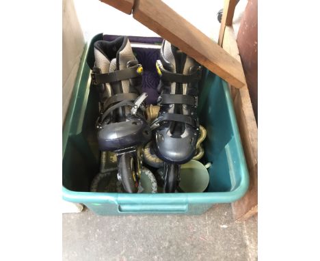 A box containing jasperware and a pair of roller skates 