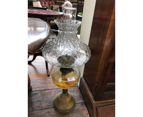A brass and glass oil lamp 
