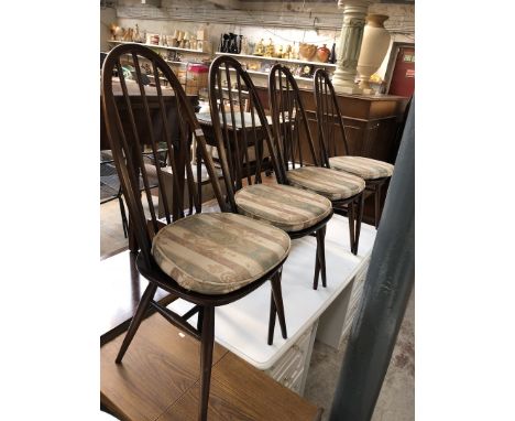 A set of 4 Ercol spindle dining chairs 