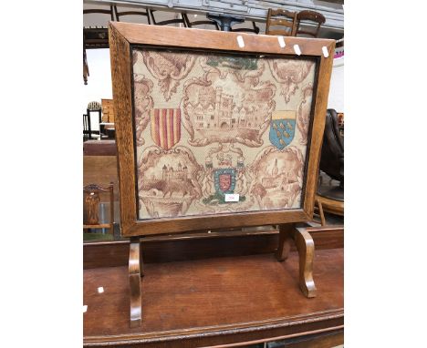 An oak framed tapestry fire screen 