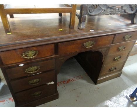 A vintage pedestal desk of nine drawers with brass handles Condition Report: please request*  *Condition is not stated in thi