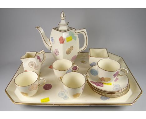 A rare British Victorian cream-ground pottery coffee-set comprising tray, coffee pot with lid, cream jug, sugar basin, four c