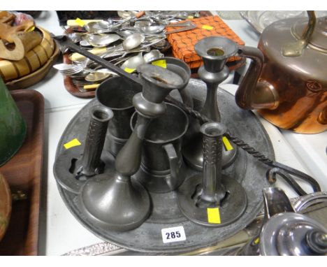 An interesting parcel of pewter including two pairs of pewter candlestick holders, three tankards ETC Condition Report: pleas