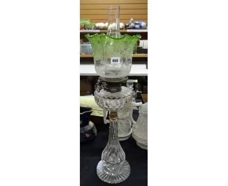 A cut glass oil lamp having a stepped base & fluted tapered column, cut glass reservoir & tinted glass shade Condition Report