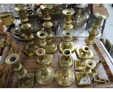 Sundry pairs of brass candlestick holders Condition Report: please request*  *Condition is not stated in this type of auction