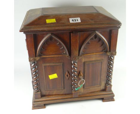 A good antique mahogany architectural style table-top chest of three drawers, concealed behind cupboard doors Condition Repor