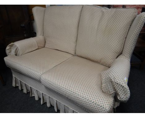 A good patterned upholstery two-seater wing back sofa Condition Report: please request*  *Condition is not stated in this typ