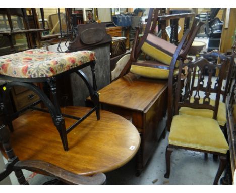 An antique mahogany drop leaf table on twist supports, four chairs, a music / dressing table stool and an oval mahogany table