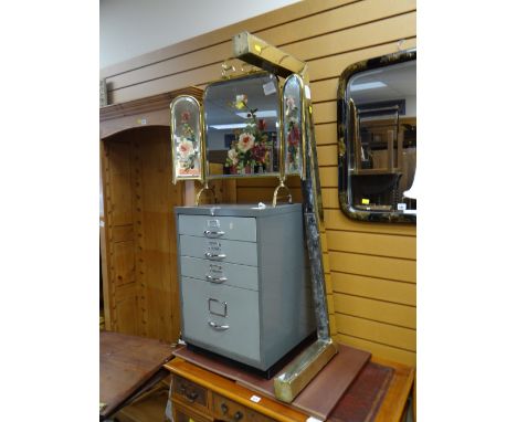 A folding painted mirror-glass firescreen, a small filing cabinet &amp; an antique brass fender Condition Report: please requ