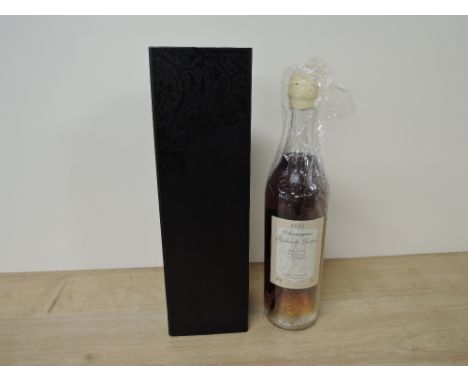A bottle of 1955 Armagnac Baron de Lustrac, 40 % vol, 70cl, reveres label L 552701105