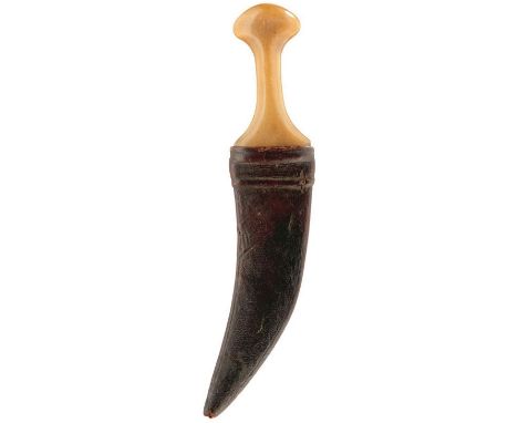 A 19TH CENTURY RHINOCEROS HORN HILTED JAMBIYA FOR A BOY, 14cm sharply curved blade with raised medial ridge, characteristic h