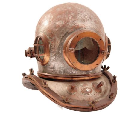 A CHINESE 12 BOLT DIVING HELMET, of characteristic form, retaining traces of tinned finish, barred oval side windows, circula