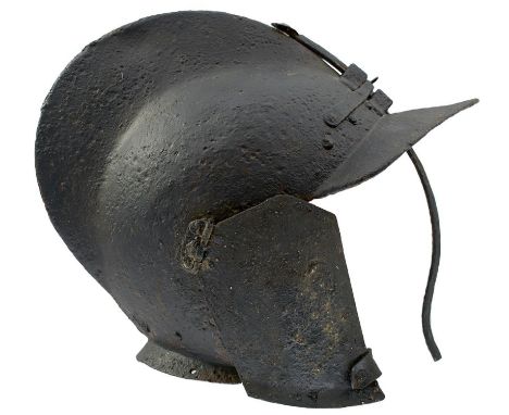 A LATE 16TH OR EARLY 17TH CENTURY GERMAN SAPPER'S BURGONET, the single piece skull with raised comb, broad pointed peak with 