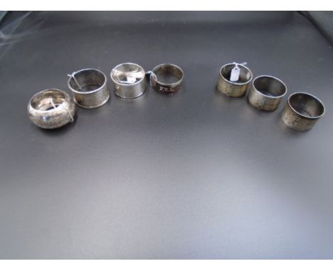 4 Silver hallmarked napkin rings, largest - 2 are London 1902 by William Hutton &amp; Sons Ltd 30g, and 25g. Sheffield 1936 b