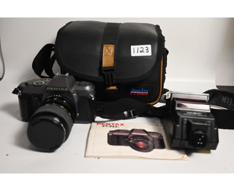 Pentax P30t, flashlight, manual in bag