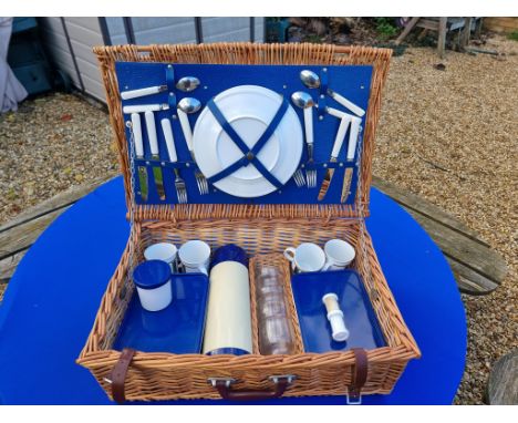Vintage retro picnic hamper in wicker basket
