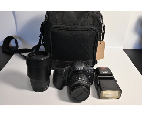 Minolta DYNAX 500si super video camera with accessories in Minolta bag. Lenses to include Sigma 28-70mm, Sigma 70-210mm