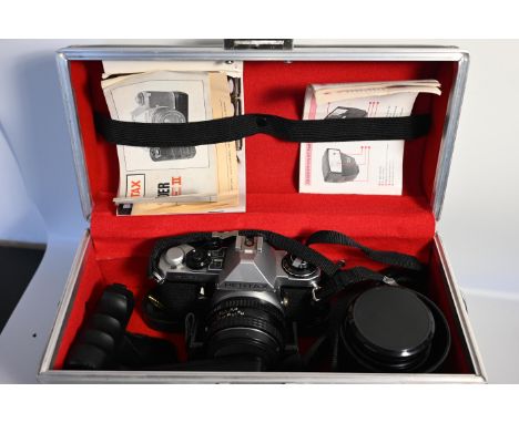 Pentax ME super camera with accessories in large leather case. Lenses to include Sicor-XL f=28mm, Pentrax-M 50mm