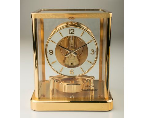 Jaeger Le Coultre, a gilt metal Atmos clock, the dial with Arabic and baton numerals, in a five glass case, serial number 650