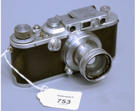 A Leica model IIIA Rangefinder camera, with Leitz Wetzlar Summar F=5cm 1,2 lens, Serial No 234245, 15cm long