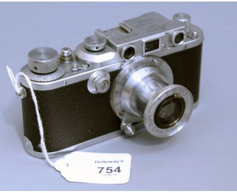 A Leica model III B Rangefinder camera, with Leitz Elmar F=5cm, 1:3,5 lens, 15cm long, Serial Number 290073