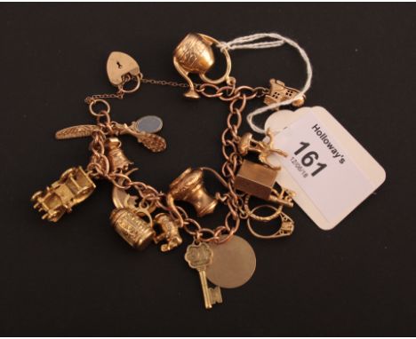 A gold charm bracelet, the 9ct open curb pattern bracelet suspending numerous charms, including a vintage car, a camel and th