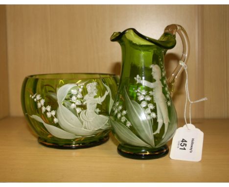 A 19th century Mary Gregory green glass jug with clear loop handle, enamel decorated with a young boy and butterfly amidst fl
