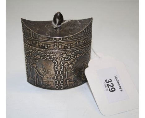 A late 19th century Dutch tea caddy, of shaped oval form, the sides and hinged cover profusely decorated with images from rur