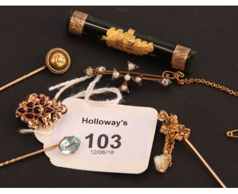 A sapphire and seed pearl stick pens, two further stick pens and three brooches