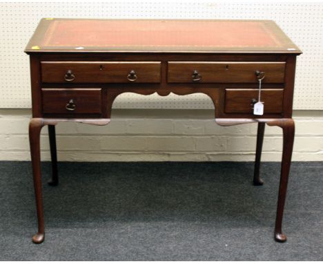 An Edwardian mahogany lady's writing desk, the rectangular top fitted with a gilt tooled red hide scriber above an arrangemen