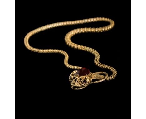 A mid Victorian garnet-set serpent necklace, the serpent's head set with an oval cabochon garnet, and cabochon ruby eyes, to 