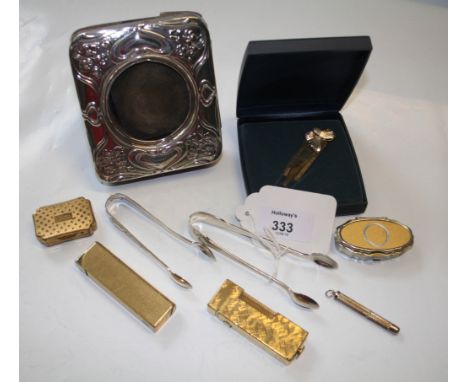 Dunhill, a gold plated engine turned cigarette lighter, signed 'Dunhill', together with another similar by Colibri, Art Nouve