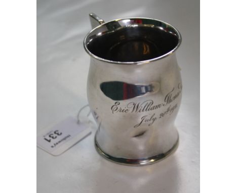 Henry Wilkinson, a silver christening mug, of bellied form, with swept ring handle, Sheffield 1910, 8cm